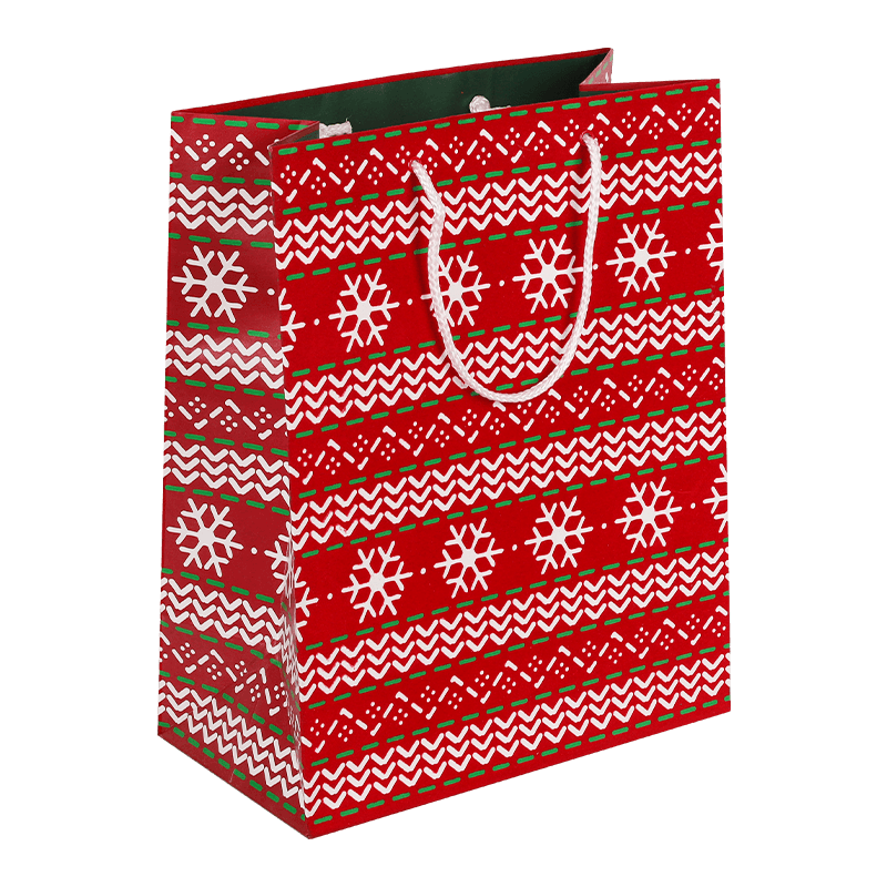 Bolsa de regalo de papel navideño con estampados navideños variados