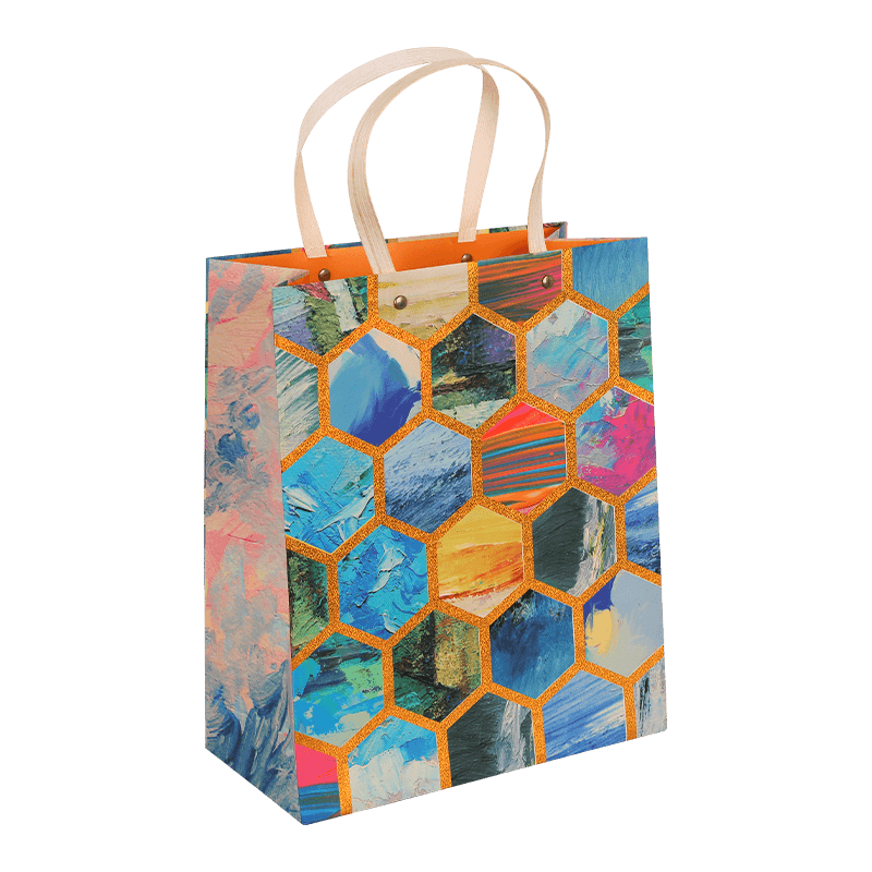 Bolsa de regalo de papel con estampado de panal multicolor