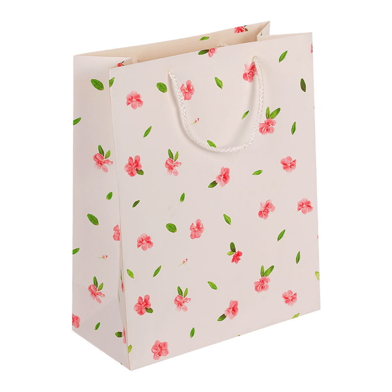 Bolsa de regalo de papel con estampado floral y asa