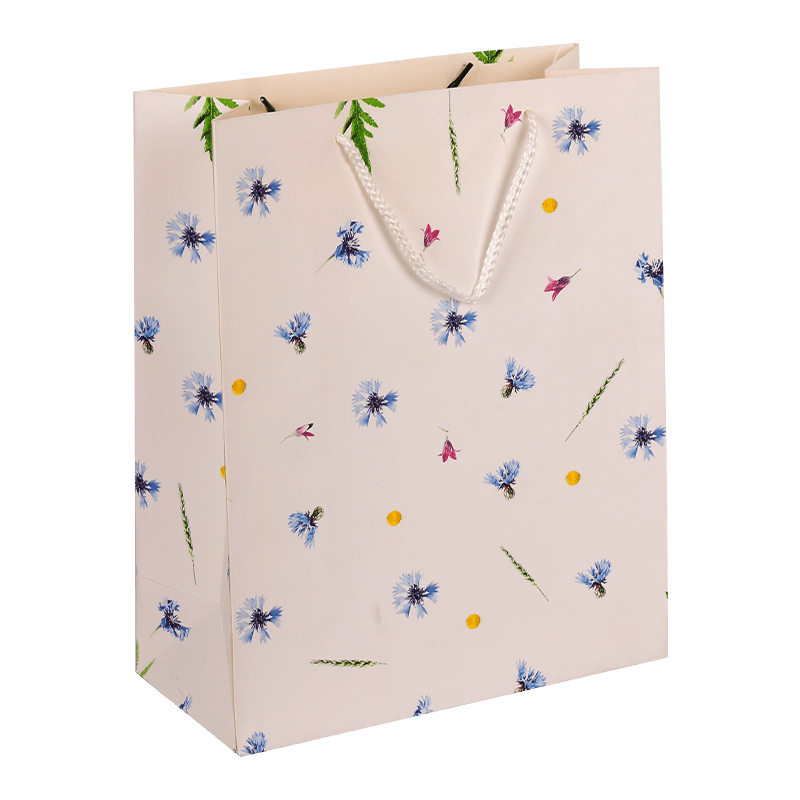 Bolsa de regalo de papel con estampado floral y asa